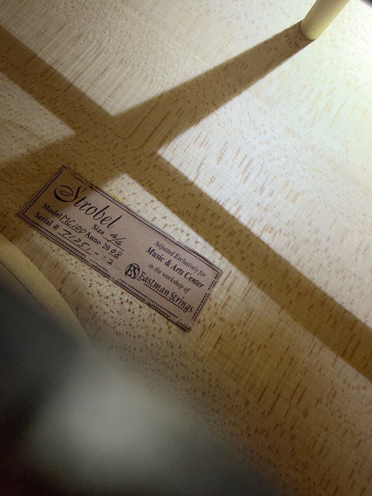 Interior label of the cello showing the Strobel MC-100 model and serial number 71251-02