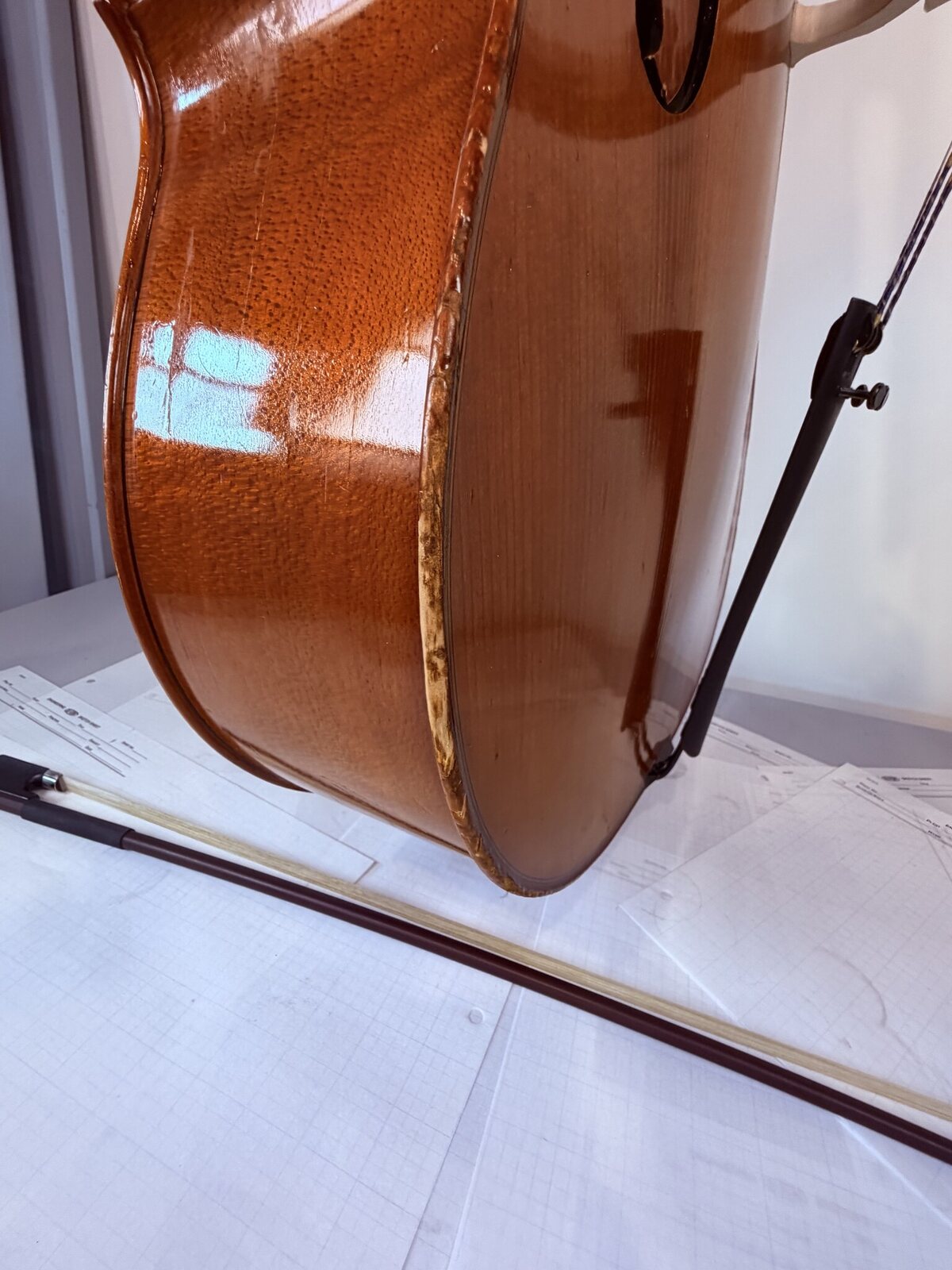 Second run of open, sloppily re-glued seam on the cello with old glue visible