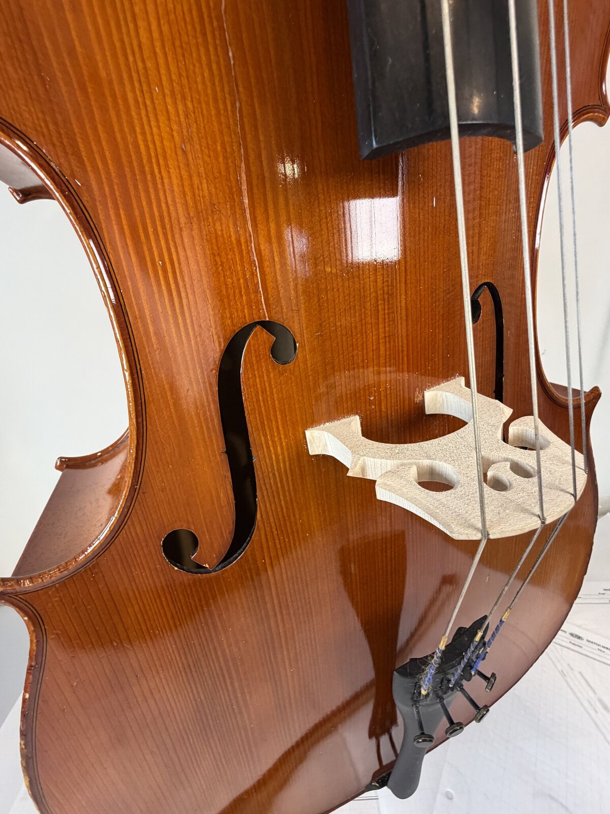 Repaired crack in the cello top on the upper bass side