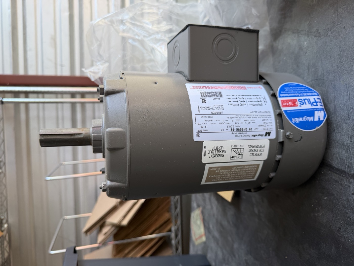 Magnetek Century E-Plus 1 HP three-phase motor, 143T frame — nameplate side with output shaft