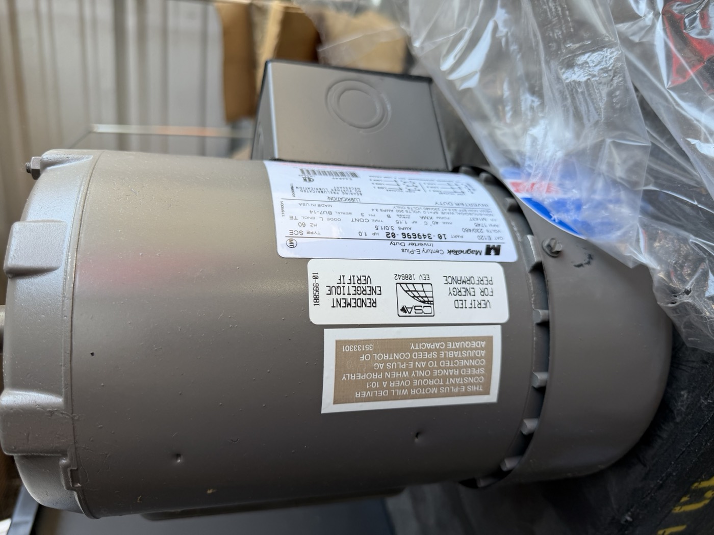 Magnetek Century E-Plus motor nameplate close-up — Type SCE, part 16-349696-02, 230/460V