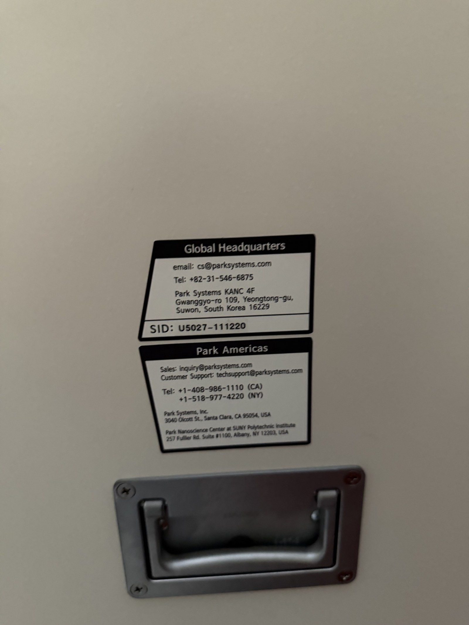 Park Systems system ID label - SID U5027-111220 with Global HQ and Park Americas contacts
